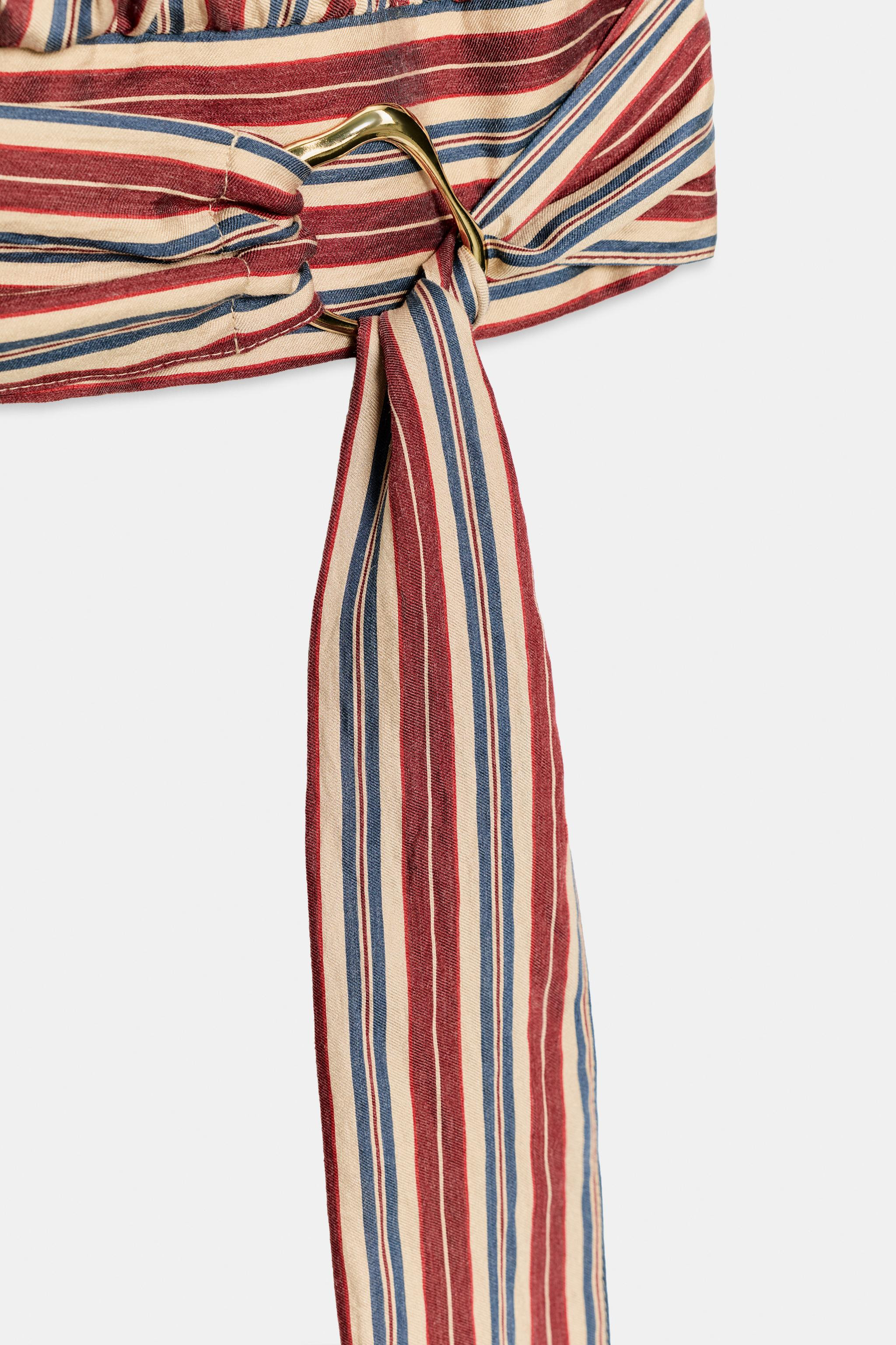 High-neck, sleeveless top featuring pleated shoulders. Designed with a knotted hem detailed with ... | Zara US