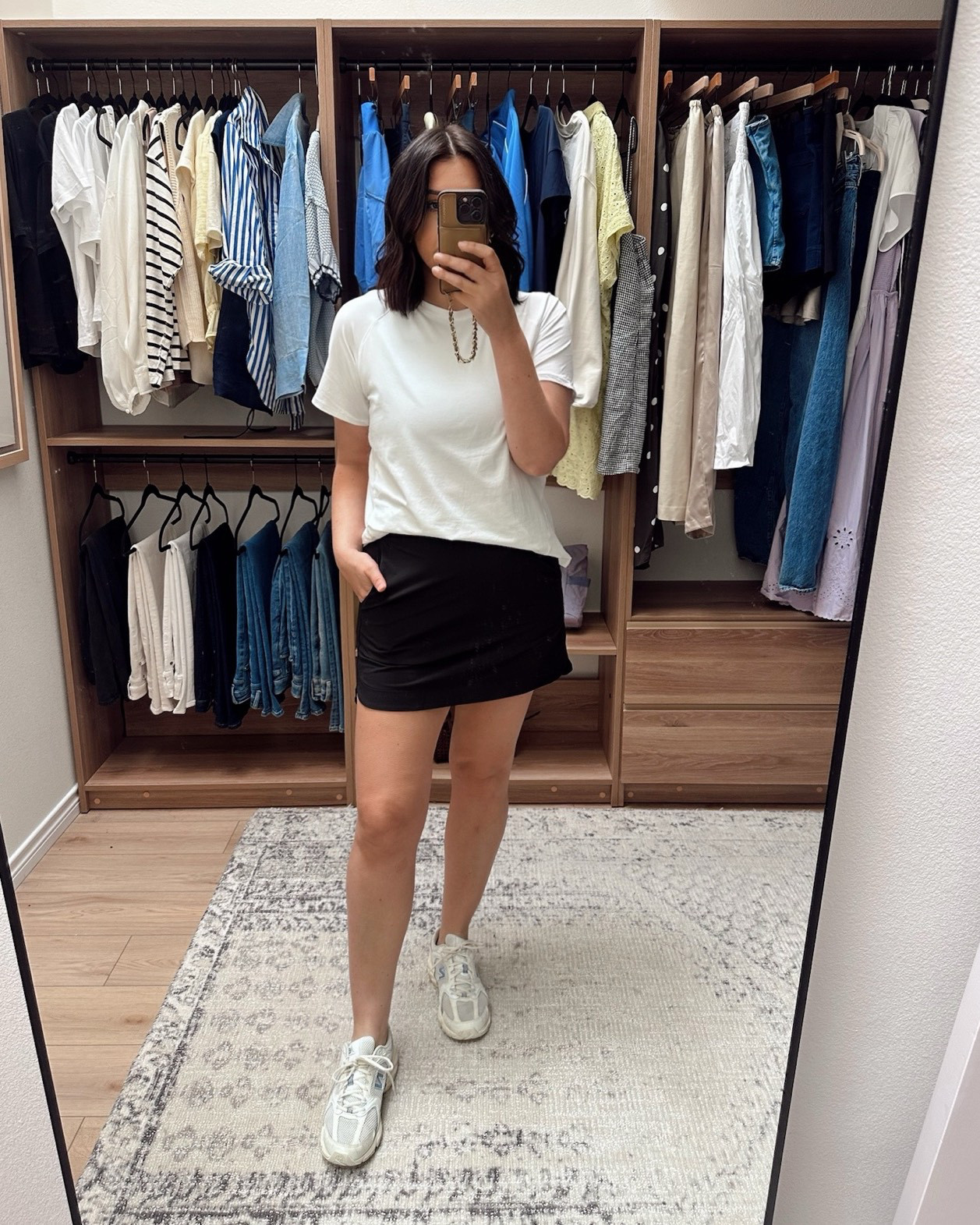 This is my very favorite tee from Amazon. It’s workout fabric, so a thicker bouncier feel. It’s non-sheer, as I’m wearing a black sports bra here. And I love the length of the sleeves. It washes out well, no shrinkage. 

I’m in size large and love this size. It’s loose and relaxed and most importantly I FEEL comfortable in it. The back as a dolphin hem situation and is a touch longer. I would say TTS with a relaxed fit. 

I have this in three colors! 

I love a skort in the spring and so I grabbed this one. It’s under $20 I believe I am in the large and it does run small / short. It has short underneath so I don’t really care much about the lenght. It fits well, but it is a smaller fit overall. The material is that swishy athletic material and it has pockets and an elastic band in the back.  

 