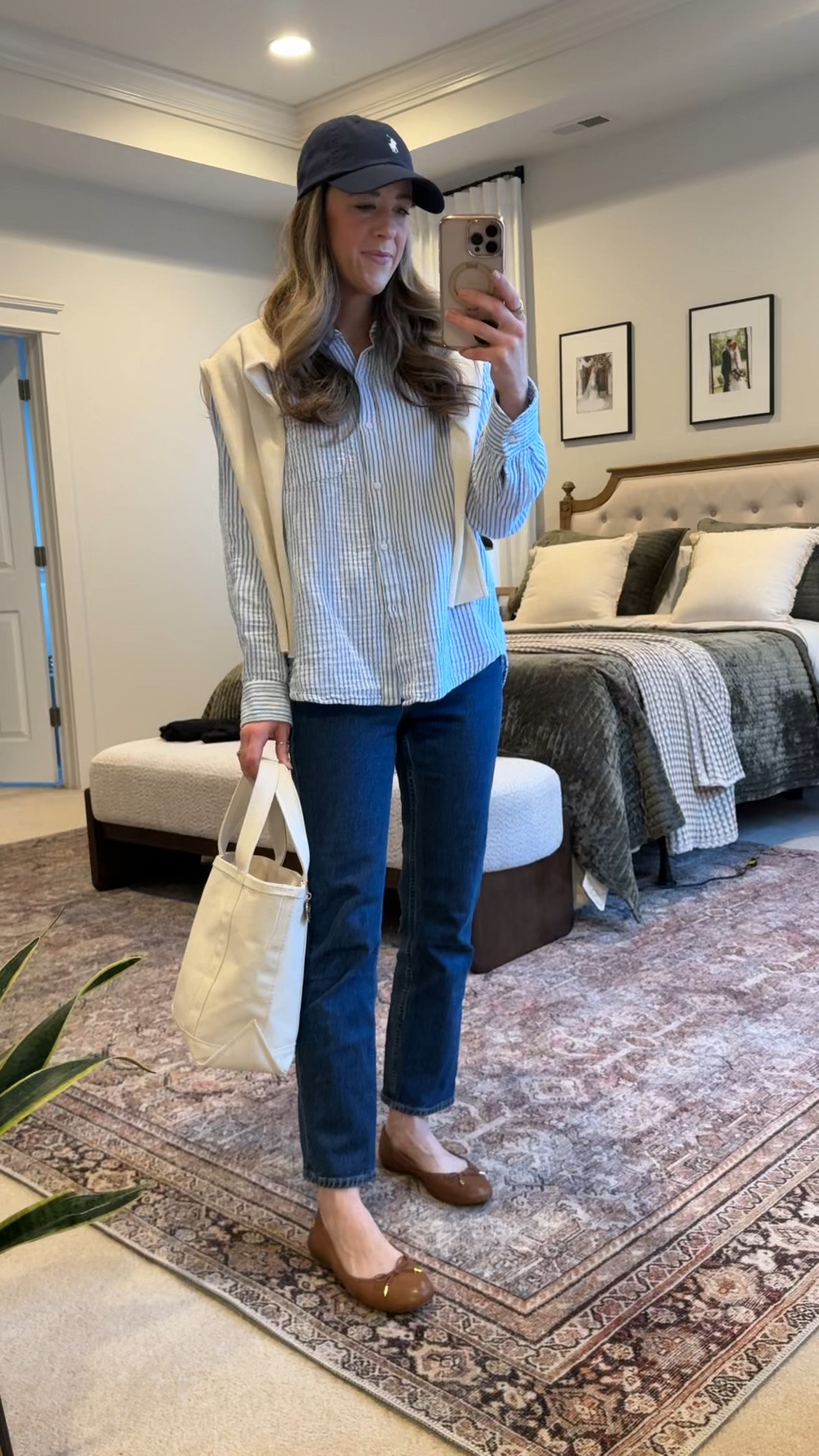 Classic preppy mom outfit 🤍

If you love timeless layering and elevated basics, this is such a good everyday formula.

Wearing:
• Quince striped button down (size S)
• Quince Mongolian cashmere sweater (size S – only $50!)
• Abercrombie high rise ankle straight jeans (26R – size up one)
• Ralph Lauren flats
• L.L. Bean small boat tote

Use Quince promo code INFG-25SIMPLYCHICMA for 10% off

A striped button down layered under cashmere instantly makes denim feel polished. The dark wash straight leg jeans keep it modern without going trendy.

Perfect for:
• Classic mom outfit ideas
• Preppy casual outfits
• Dark wash jeans outfit
• Capsule wardrobe layering
• Business casual denim
• Everyday polished style

This is one of those outfits that works for school drop off, errands, casual meetings, or travel days.

#LTKgrwm #LTKSeasonal #LTKWorkwear