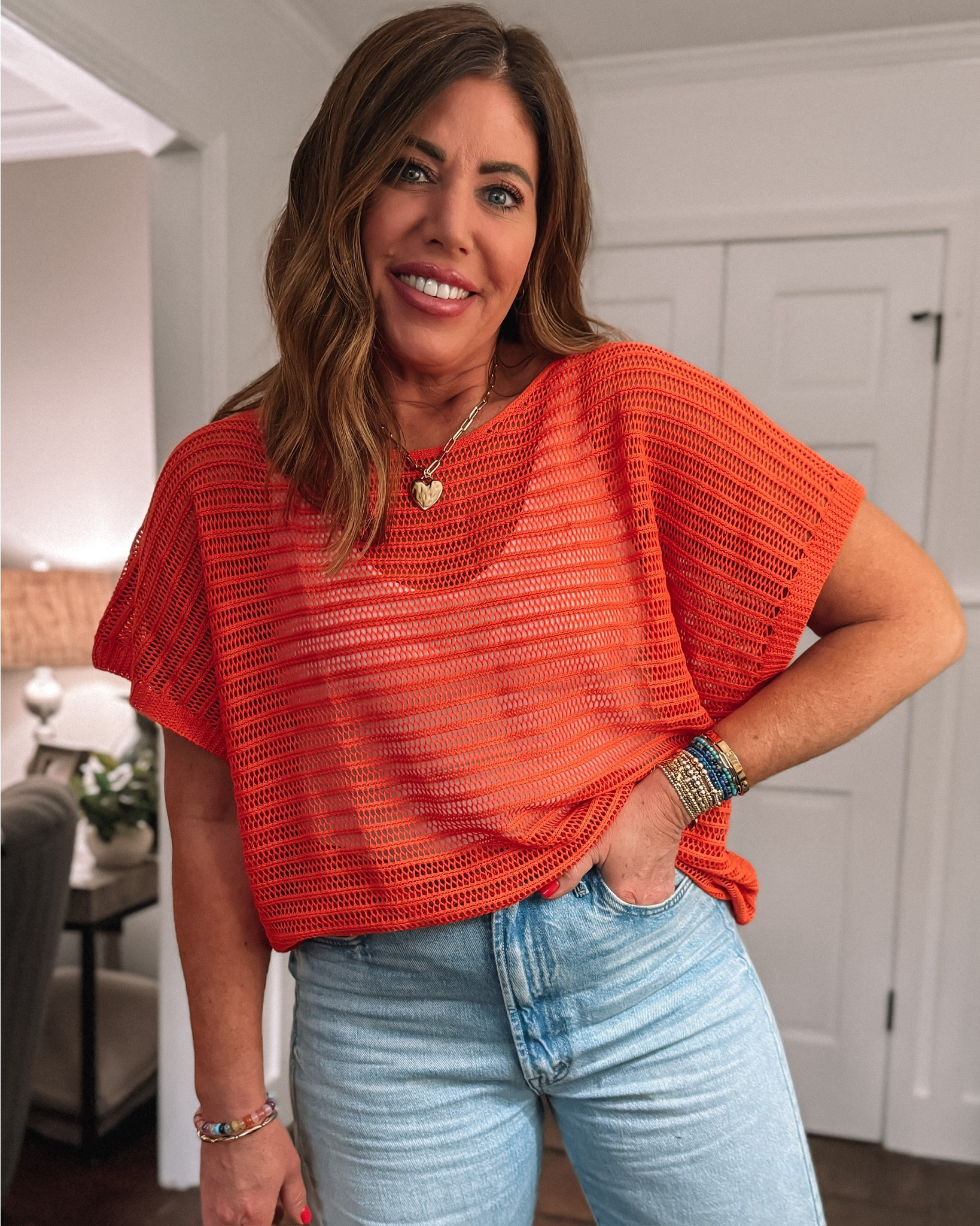 One of my favorite Amazon spring sweaters🚨it's so lightweight and perfect for spring into summer! I ordered a large in this orange oversized open knit sweater and a 30 in the jeans.  


#LTKMidsize #LTKootd #LTKOver40