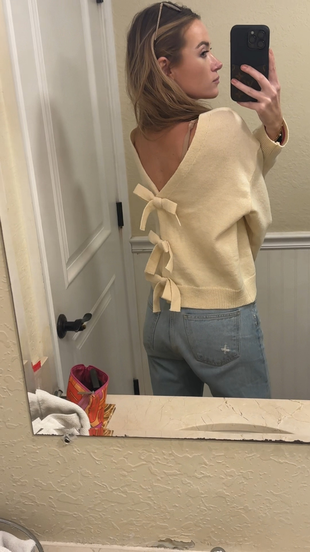 Neutral Amazon long sleeve sweater that can be worn with the bows in the back or the front. Amazon fashion find. Comes in cream and black. 

#LTKWatchNow #LTKFindsUnder50