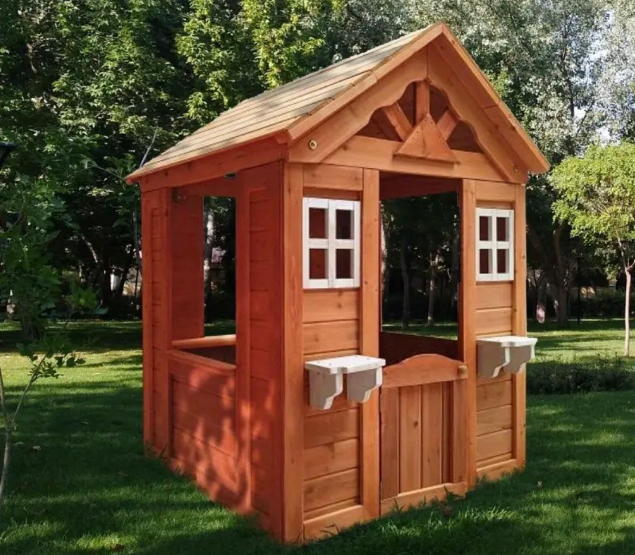 Wooden outdoor play house in a golden color 

#playhouse
#woodenhouse 

#LTKBaby #LTKKids #LTKFamily