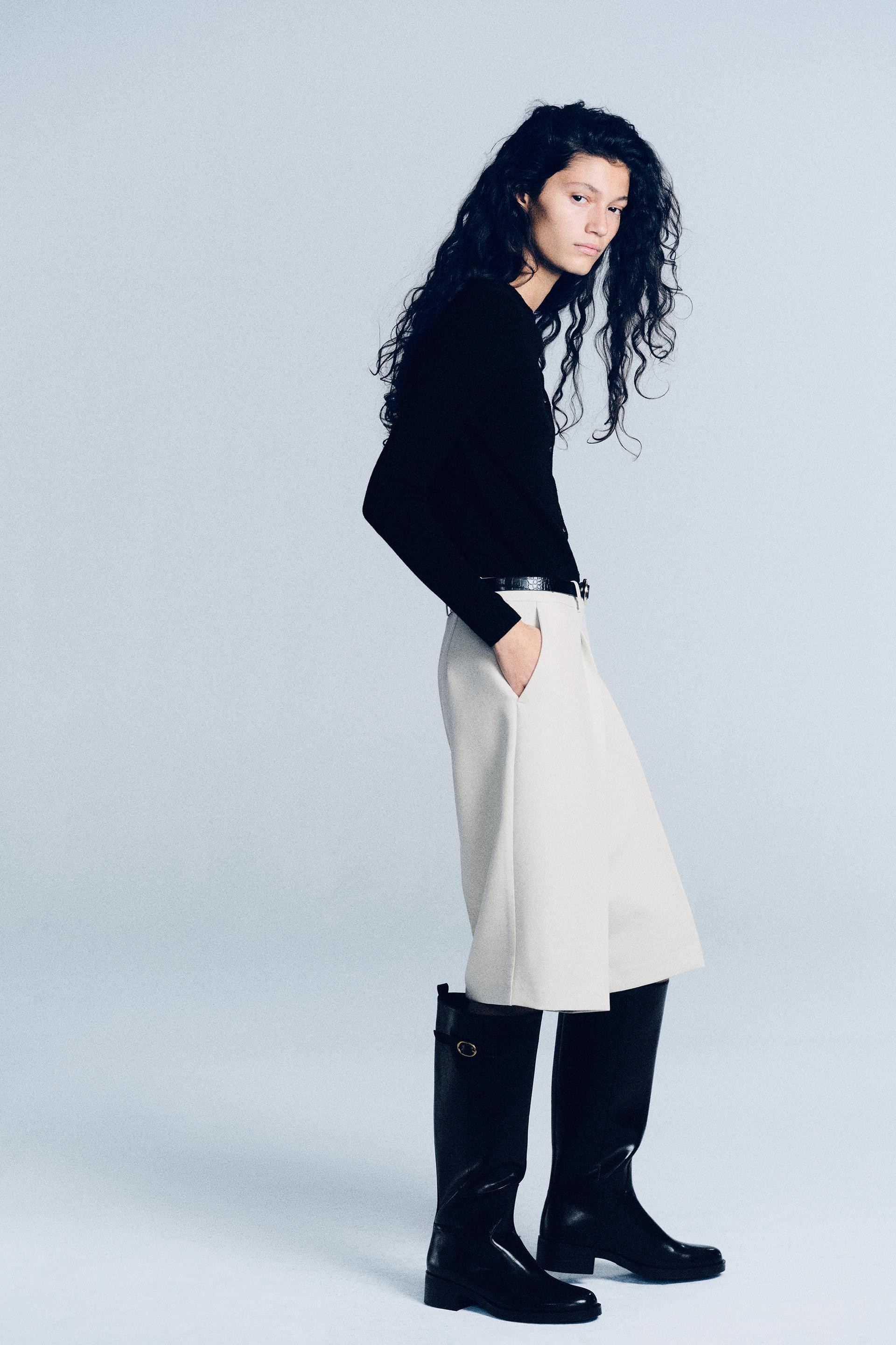 Equestrian-style boots. Strap detail with a metal buckle on the shaft. Rear pull tab. High shaft.... | Zara DE