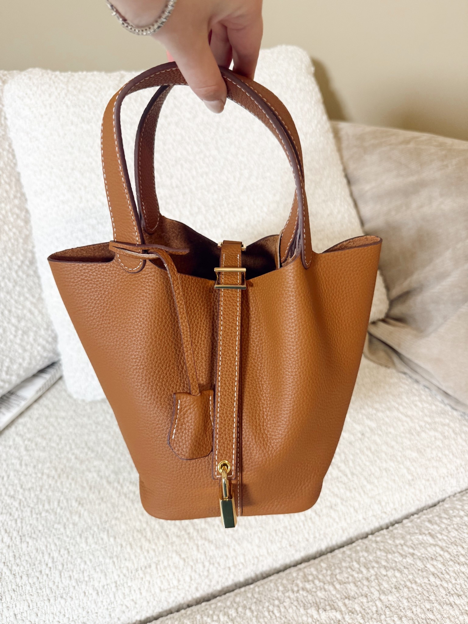 The prettiest leather bucket bag with gold hardware lock and key purse

#LTKFindsUnder100 #LTKSeasonal #LTKItBag