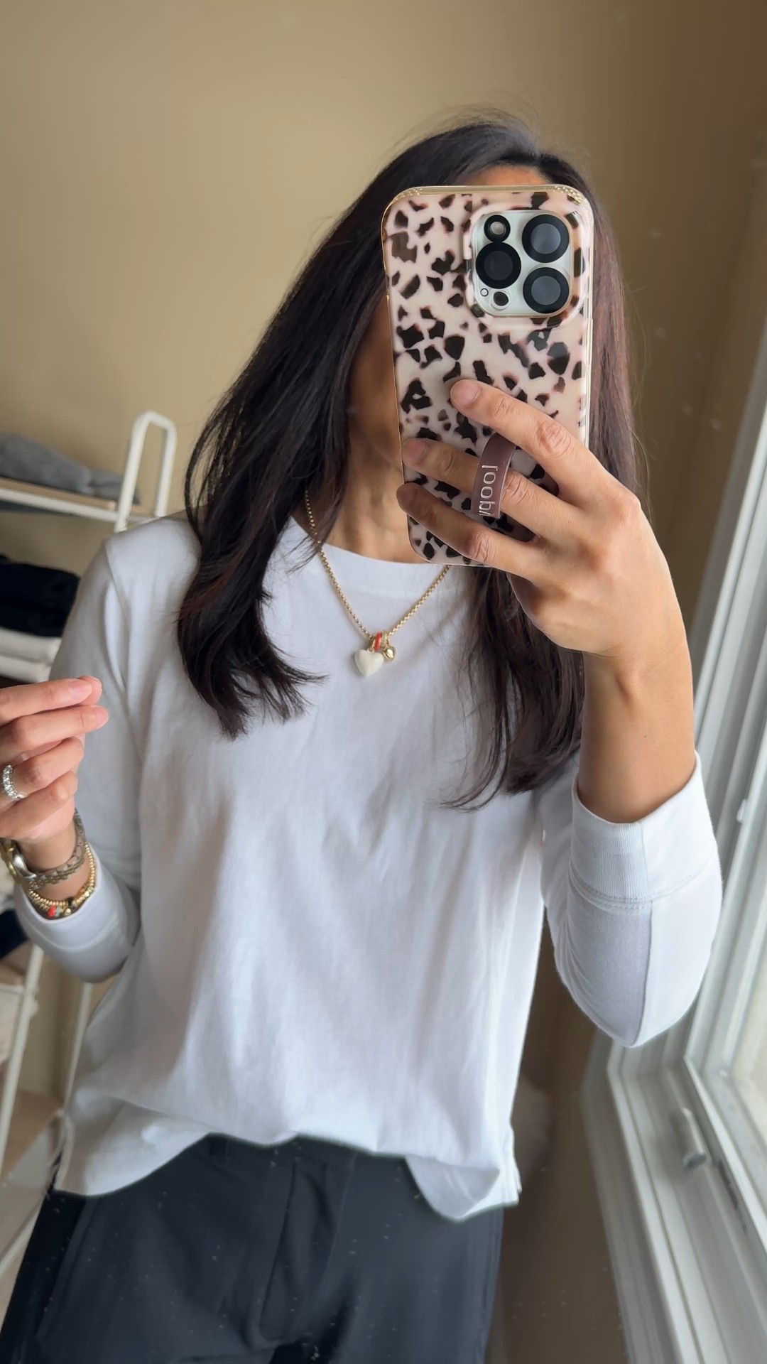 Charm necklace. My favorite charm necklace this year. I recently got a new heart charm in white to add to it. 
Also got these new elastic gold beaded bracelets with sliders that add a little color and interest  

#LTKOver40 #LTKFindsUnder100