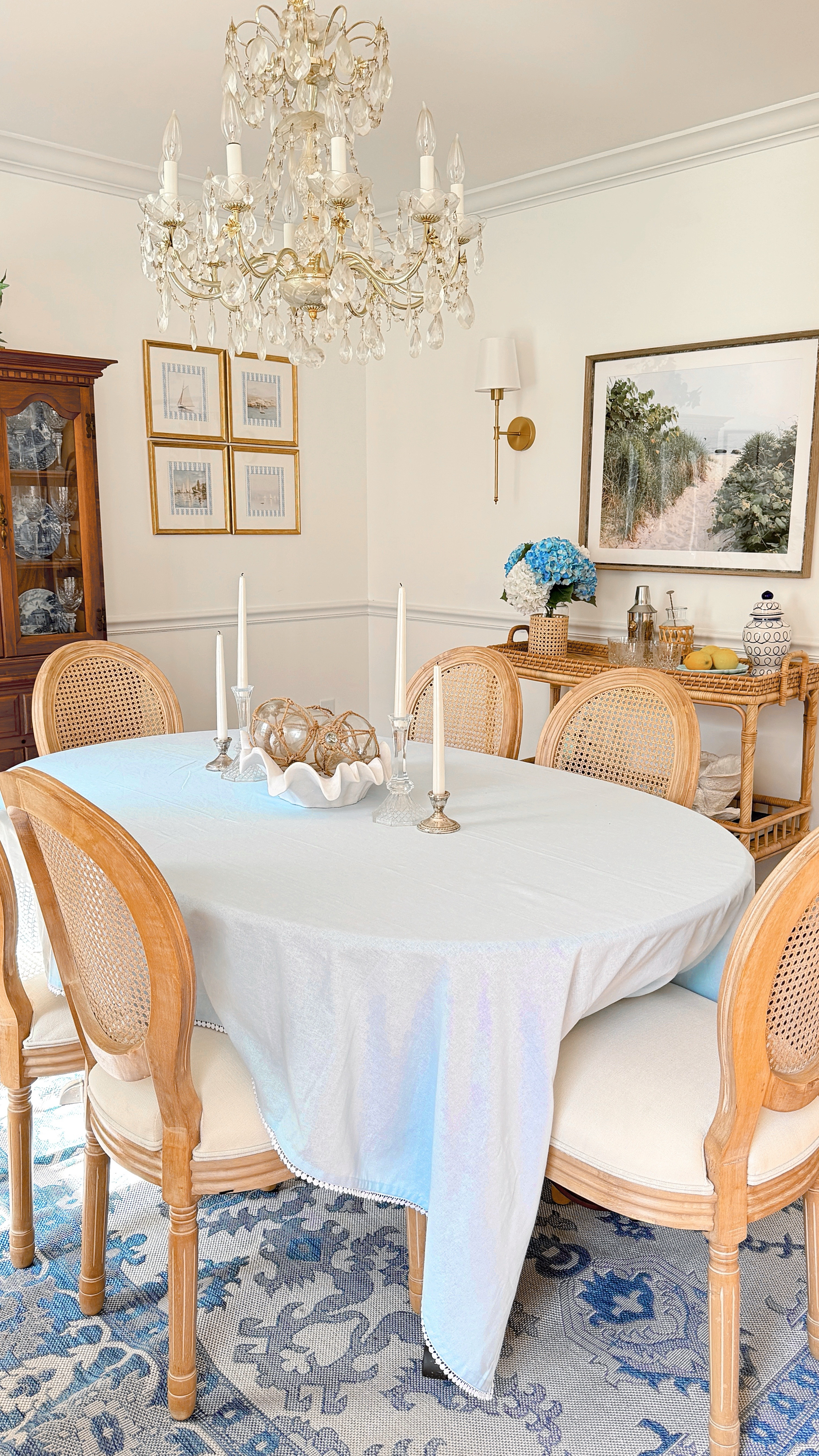 A few simple swaps totally transformed our dining space ✨ These French-style cane back dining chairs instantly elevated the look. It’s classic, timeless, and perfect for our blue and white coastal decor. Anchoring everything with my favorite rattan bar cart from Serena & Lily for that extra coastal touch (it’s as pretty as it is practical), and finished the space with remote-controlled wireless wall sconces—so easy to install and perfect for cozy lighting.

Everything’s linked here—if you’re updating your dining room, these finds are worth it 🤍

#DiningRoomDecor #LTKHome #LTKFinds #CaneBackChairs #SerenaAndLilyStyle #CoastalDecor #HomeInspo #BlueAndWhiteAesthetic #RattanStyle #WirelessLighting #NancyMeyersVibes #LTKSale #CoastalHomeStyle

#LTKHome #LTKStyleTip #LTKSeasonal