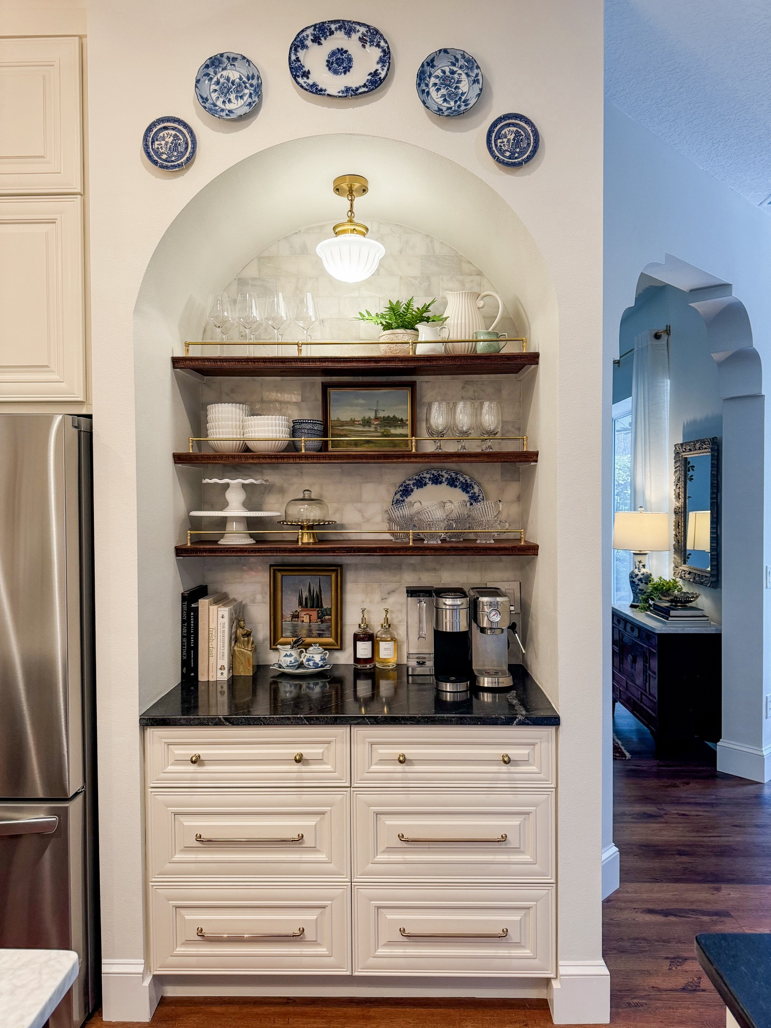 Coffee & Tea Bar 

Coffee maker, expresso maker, brass rails, syrup dispenser, coffee bar decor, pendent light 

#LTKHome