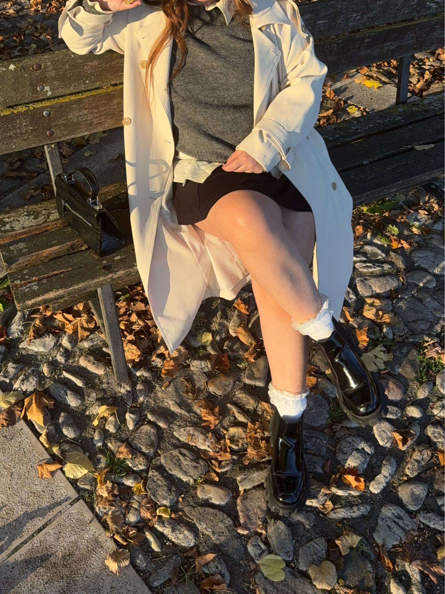 Cute fall outfit wearing a trench coat, grey oversized sweater, black skirt, yellow button up, black boots and white socks 

#LTKmidsize #LTKstyletip #LTKeurope