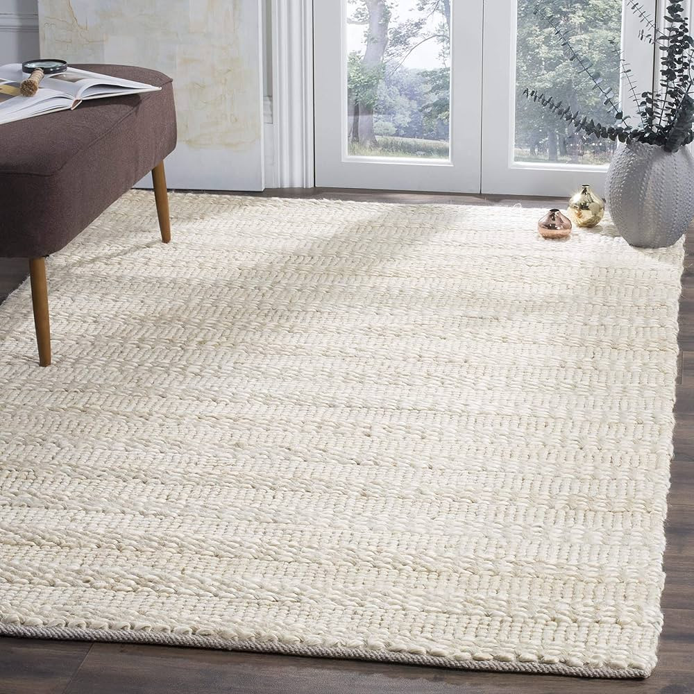 SAFAVIEH Natural Fiber Collection 8' x 10' Bleach NF212D Handmade Braided Woven Jute Area Rug | Amazon (US)