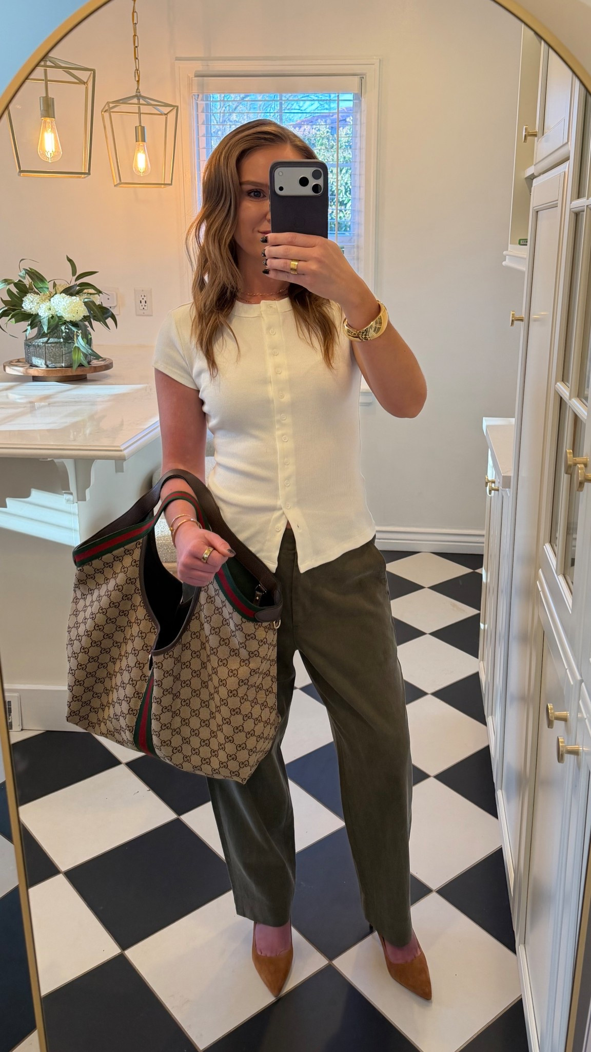 St. Patrick’s Day OOTD 🍀 Wearing a Reformation top with Banana Republic pants and the comfiest Veronica Beard heels. First time wearing them and they didn’t hurt my feet at all. PSA: they run small — I went half a size down. Paired with my Gucci tote and simple Amazon jewelry.

Hashtags for visibility:
#LTKStyle #LTKWorkwear #LTKFinds #OOTD #WorkOutfit #BusinessCasual #EverydayStyle #CapsuleWardrobe #ClassicStyle #StPatricksDayOutfit #AmazonJewelry #GucciBag #VeronicaBeard #Gucci #WorkOutfit #OfficeStyle #WorkWear #BananaRepublic #Reformation #GreenPants #KittenHeels #WorkBag #Amazon #Gold

#LTKPetite #LTKootd #LTKWorkwear