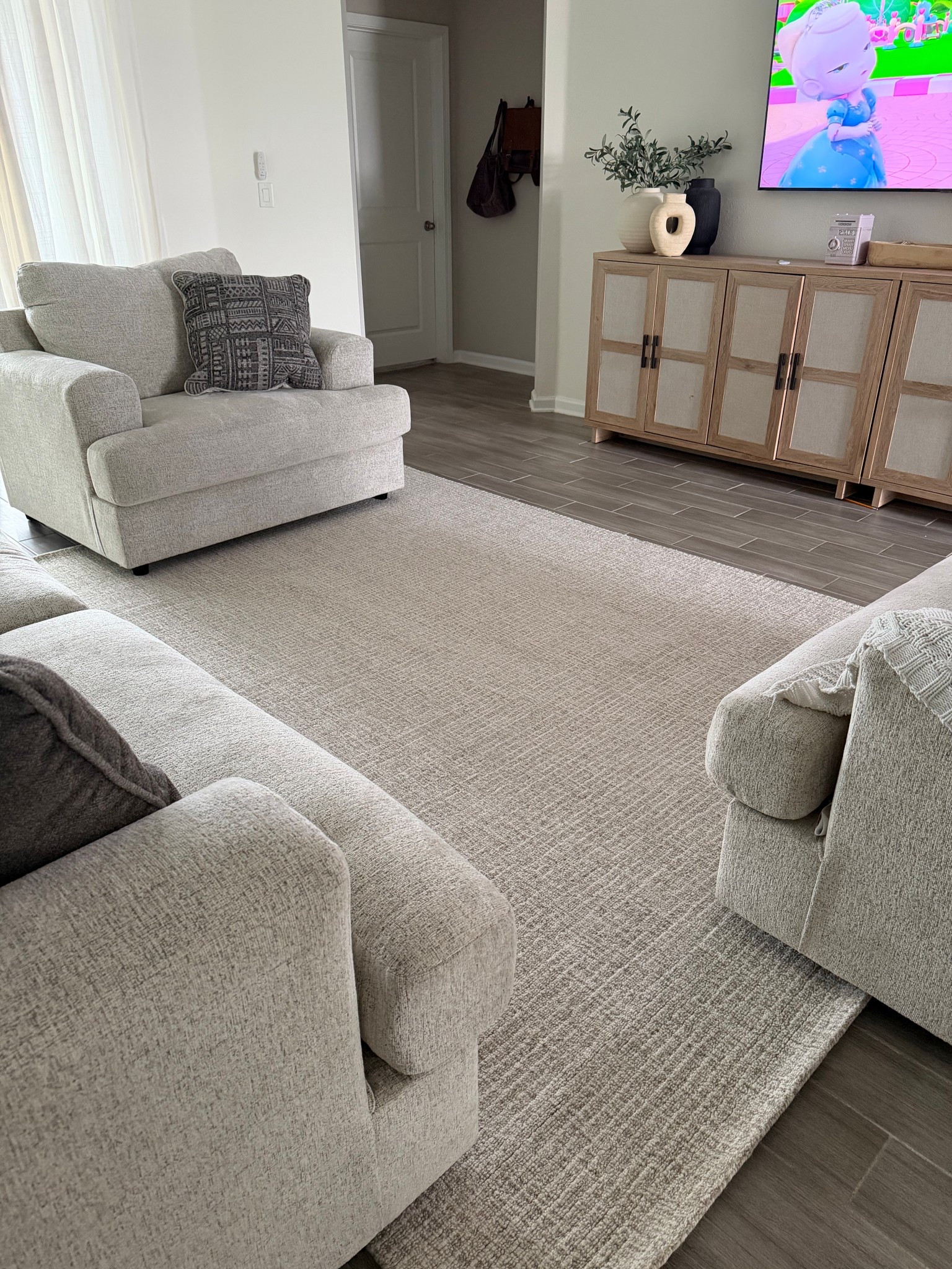 Neutral living room modern living room tv stand oversized chair neutral rug 

#LTKdayinmylife #LTKmomlife #LTKHome