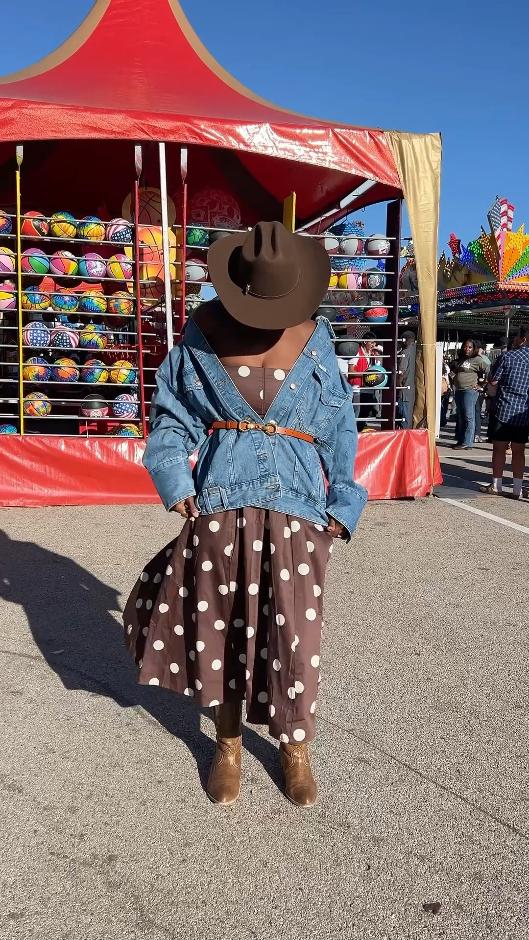 Western outfit for rodeo or festival season! Polka dot dress, oversized trucker jacket, brown cowgirl hat, brown western boots, vintage gold earrings. 

#LTKFestival