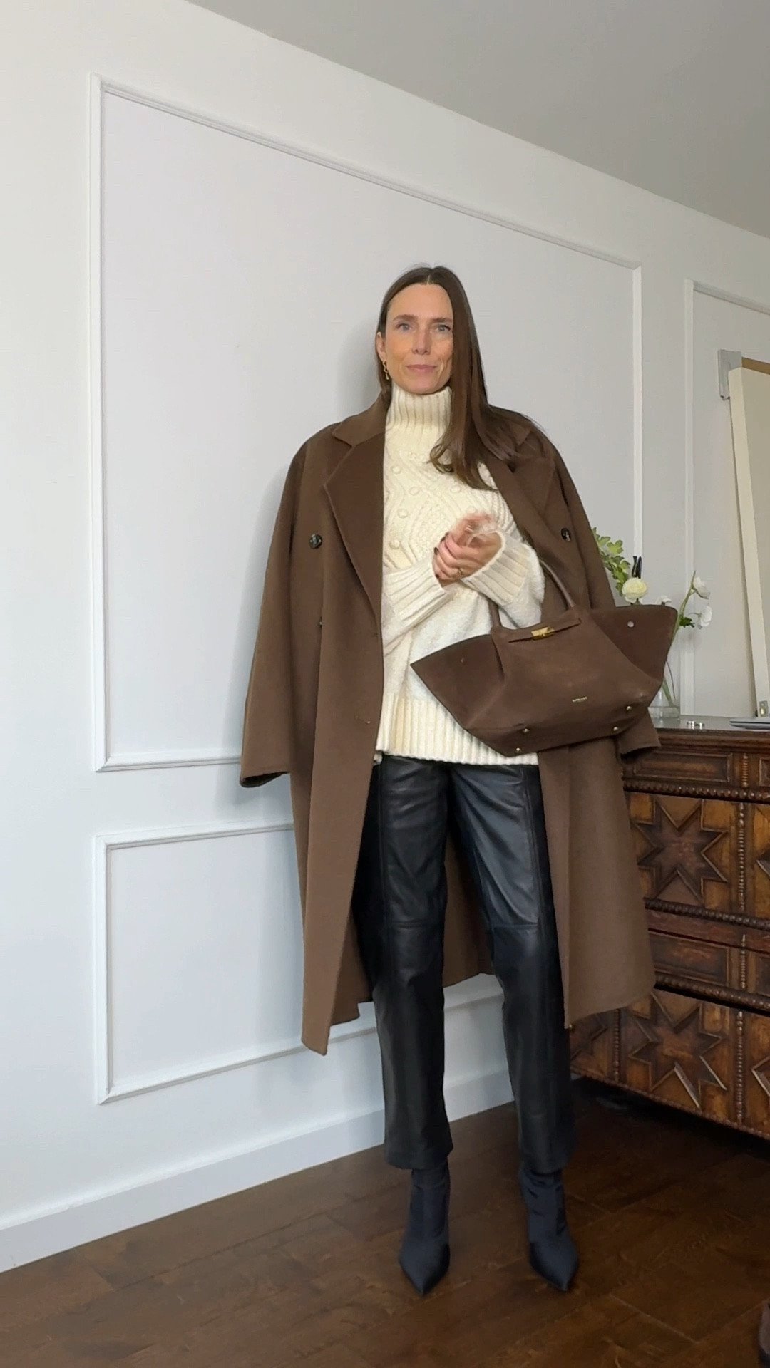 The perfect winter outfit: black leather trousers, a soft and cost cream knit and a brown wool coat. Finished off with a brown suede handbag and a pointed black sock boot 👌🏻

#LTKSeasonal #LTKShoeCrush #LTKStyleTip