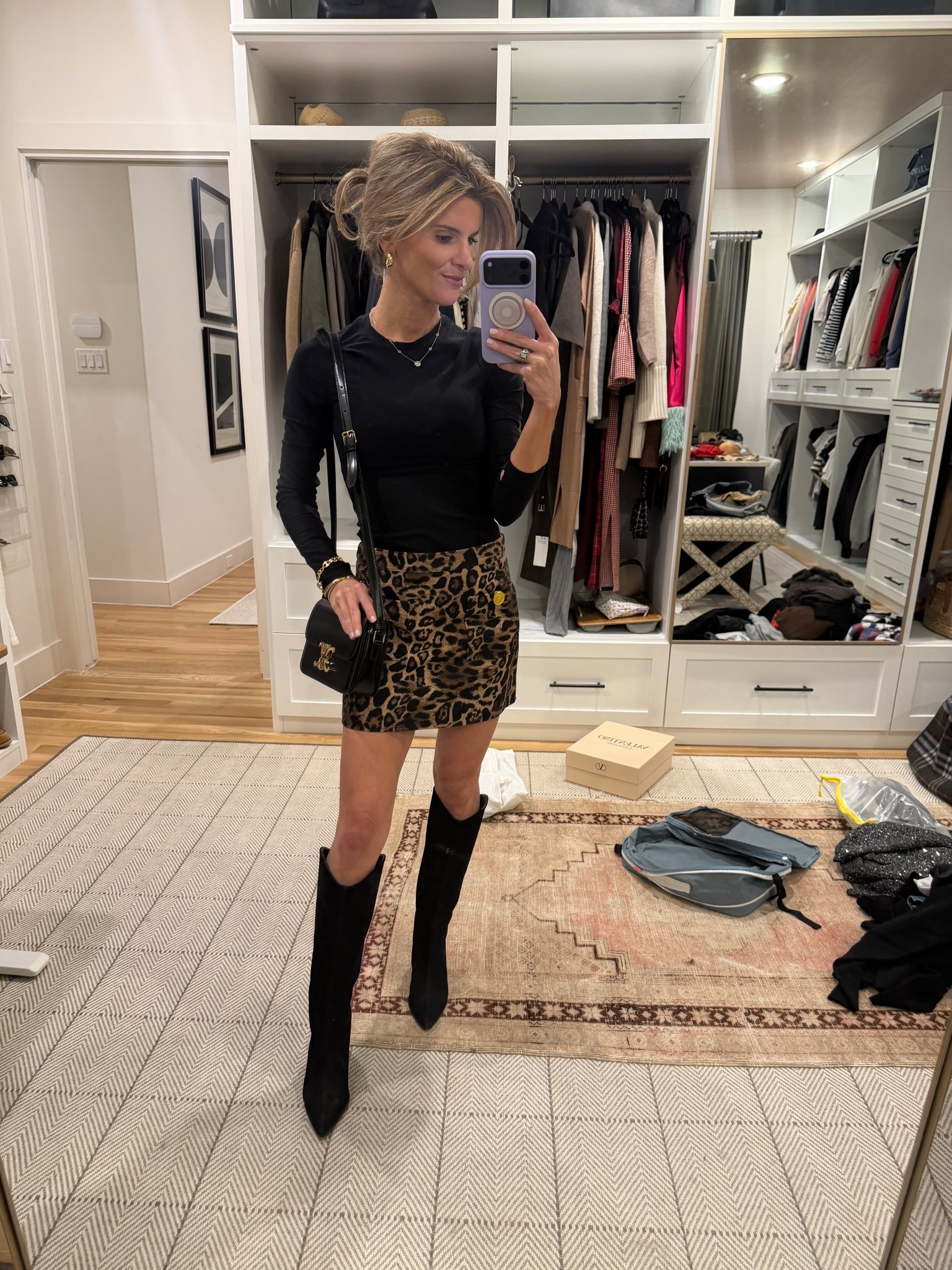 Leopard print skirt and black top and boots 
