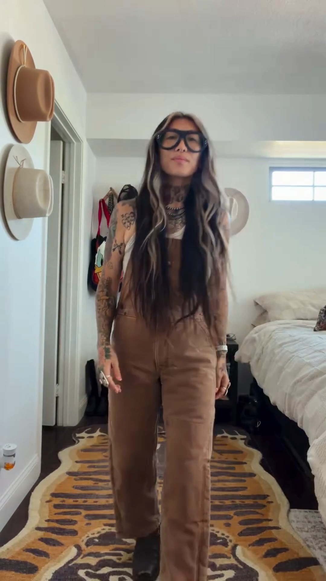 It’s Sunday. Come on, let’s go to @bornfreeshow ❤️‍🔥

Top: @freepeople 
Overalls: @carhartt kids insulted bib 
Boots: no. 2037 @pskaufman 
Rings: @americandecaychicago 
Watch: the Coda @bredastudio 
Tote: @_krispy.co_ 
Glasses: the Carlton @efeglasses_official 

#whatshesgoton #ootd #grwm #bornfree17