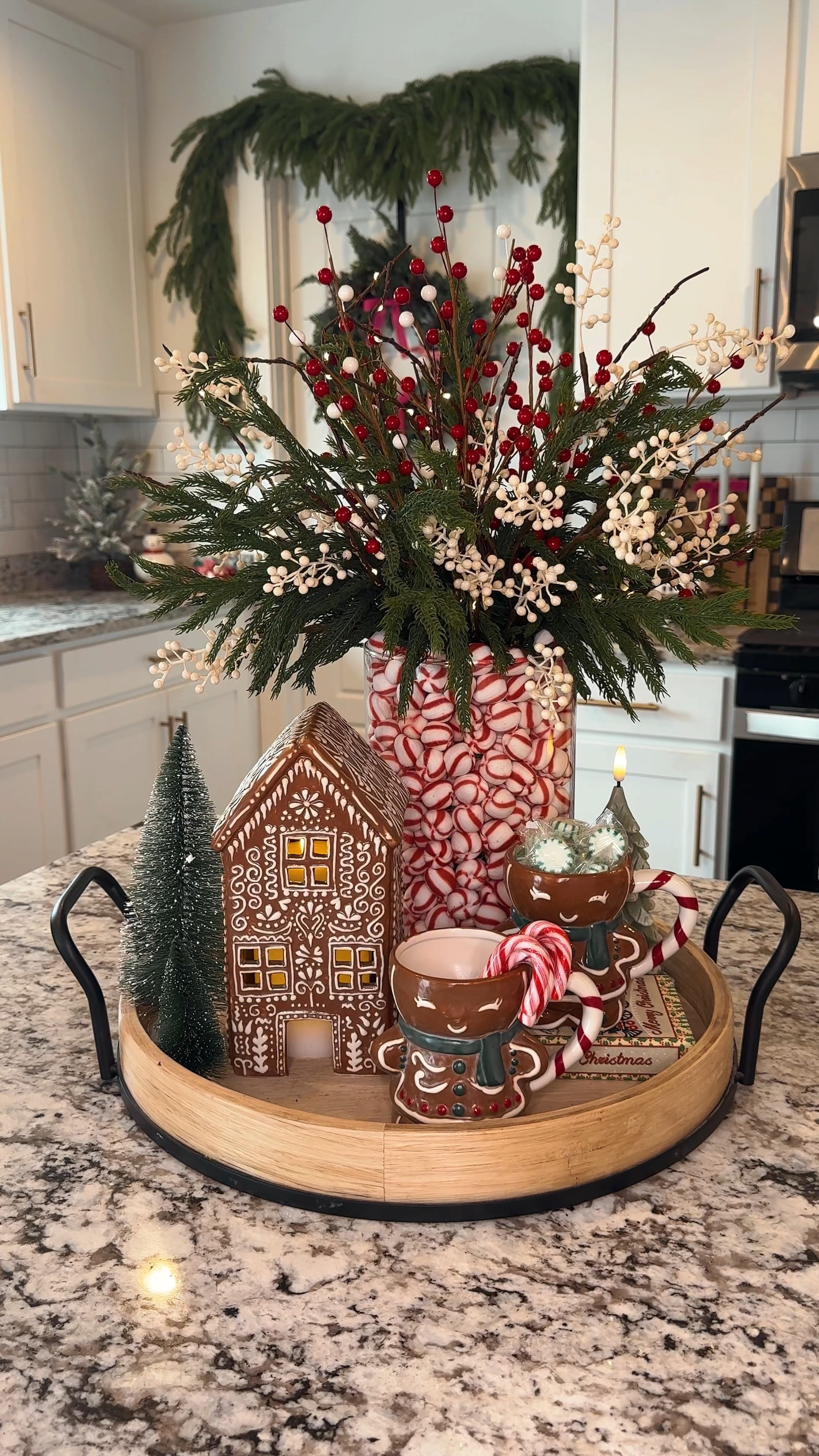 All exact products linked to re create this! Linked my Amazon lit branches, and Norfolk pine branch stems. Small Etsy berry branches are exact. Clipped the fall leaves off of the Etsy ones for this arrangement! Pottery Barn gingerbread house and mugs..

Pink Lily sweater - use code CHERISH for 20% off sitewide at checkout!

#LTKVideo #LTKHoliday #LTKHome