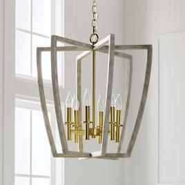 Sleek and modern design characterizes this eye-catching chandelier. Features metal with a wood-li... | Frontgate