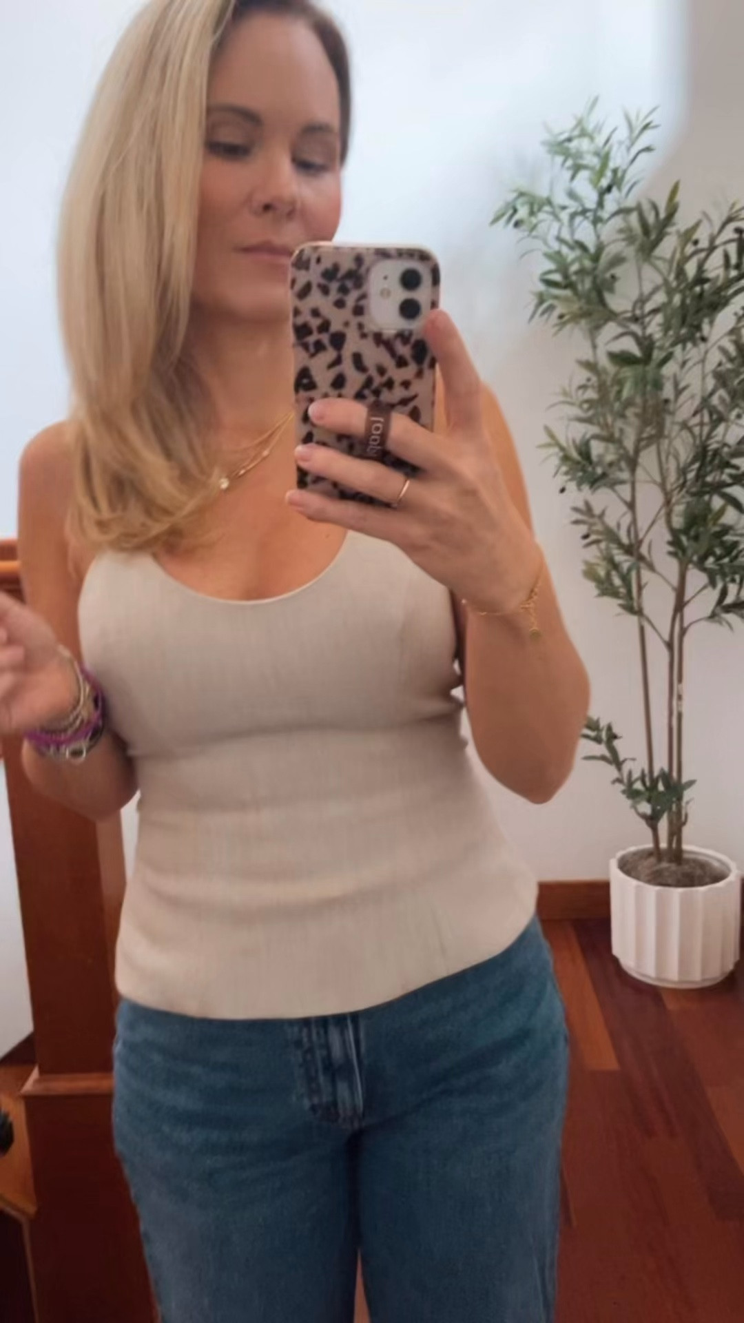 I loved how cute this is absolutely stunning peace from Aritzia paired with a pair of Aritzia jeans. This top is the halter top, but it does have a zipper in the back, which makes it really easy to put on and then ties at the top. Just really cute comfy and looks fantastic with everything. ￼

#LTKPetite #LTKOver40 #LTKdayinmylife