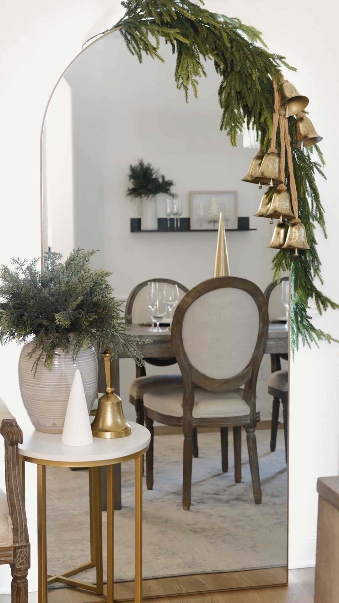 Christmas Arched Mirror ✨ Dress up your leaning mirror for the holidays! I added a strand of Norfolk garland and bells draped down the side. 

For a more dramatic look, you can add several strands of garland cascading to the floor. 

🌲Comment SHOP for link 🌲
The Norfolk garland usually sells out every year!

#LTKSeasonal #LTKhome #LTKHoliday