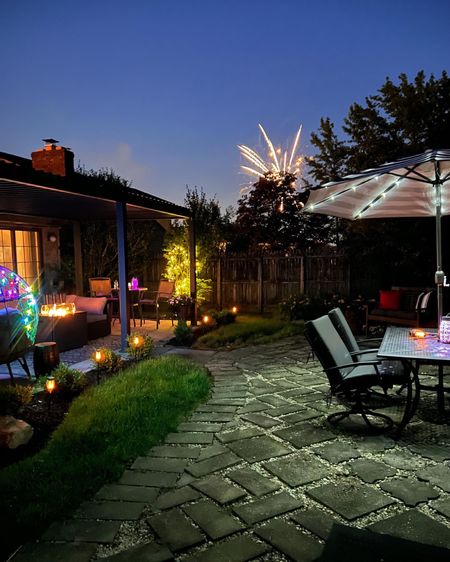 Outdoor patio views - Aluminum pergola with louvres is from Wayfair but also found on Amazon - 8 feet umbrellas with solar lights - egg chair - battery operated string lights - solar torch pathway lights - patio furniture - summer yard - patio decor - patio vibes - Amazon Home - Amazon vibes 

#LTKunder100 #LTKSeasonal #LTKhome