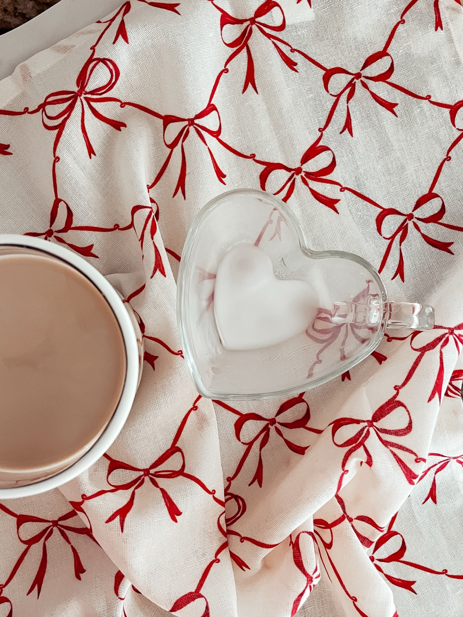 { ❥

• World Market White and Red Bow Napkin 

*similar heart mug linked 

Valentine’s Day Mug . Heart Shaped Mug } 

#LTKSeasonal #LTKHome