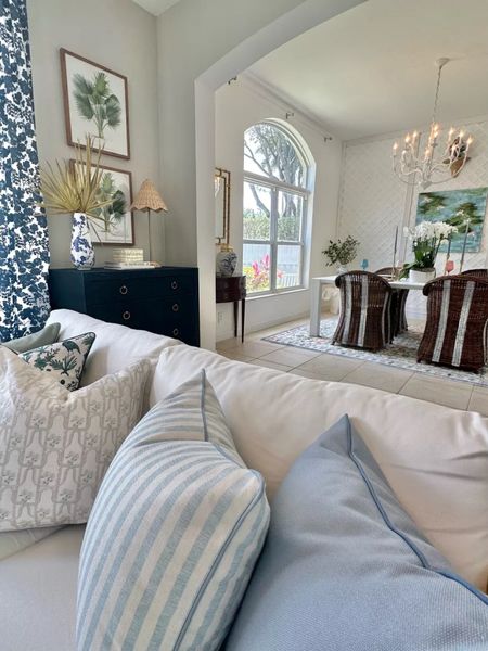Coastal living room sources, affordable sofa, pillows, white coffee table, blue and white curtains, patterned curtains

#LTKHome