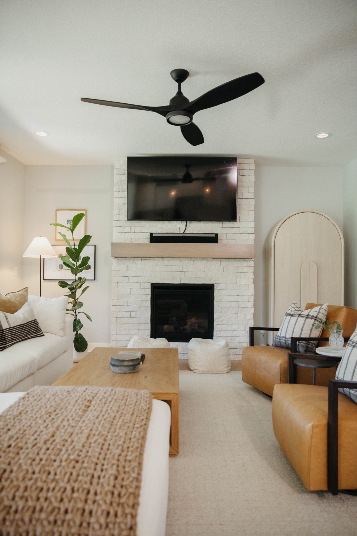 Airy living room design for a calm cool collected, modern, livable luxury feel with a white sofa, leather side, chairs, Empire, shade floor lamp, large, easy, plant tree, and lots of texture.

#LTKHome #LTKStyleTip #LTKSeasonal