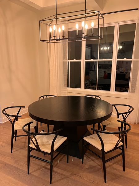 Our dining table with the two leaves removed! LOVE this setup! 

Black dining table, modern dining table, round dining table 

#LTKhome #LTKFind #LTKstyletip
