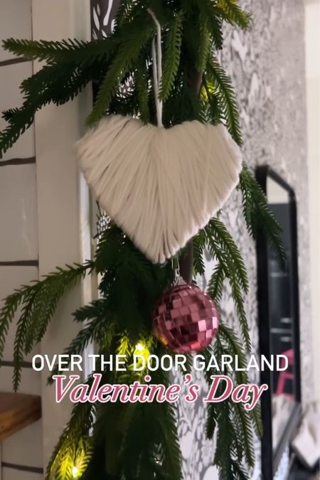 Over the door garland: Valentine’s Day, edition! Hang up this pine garland, wrap it in twinkle lights and add yarn-wrapped hearts, and pink disco balls for a festive valentines day garland! ✨💕✨✨

#LTKSeasonal