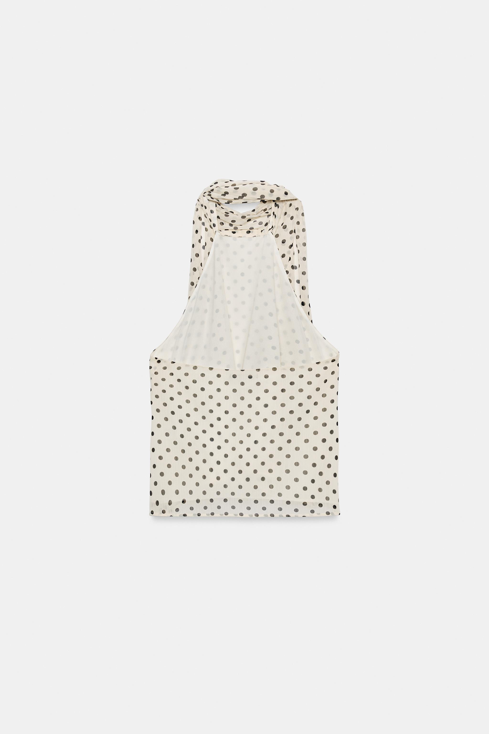 Model height: 180 cmHalter neck top with ruffles and open back. Featuring hidden button fastening... | Zara DE