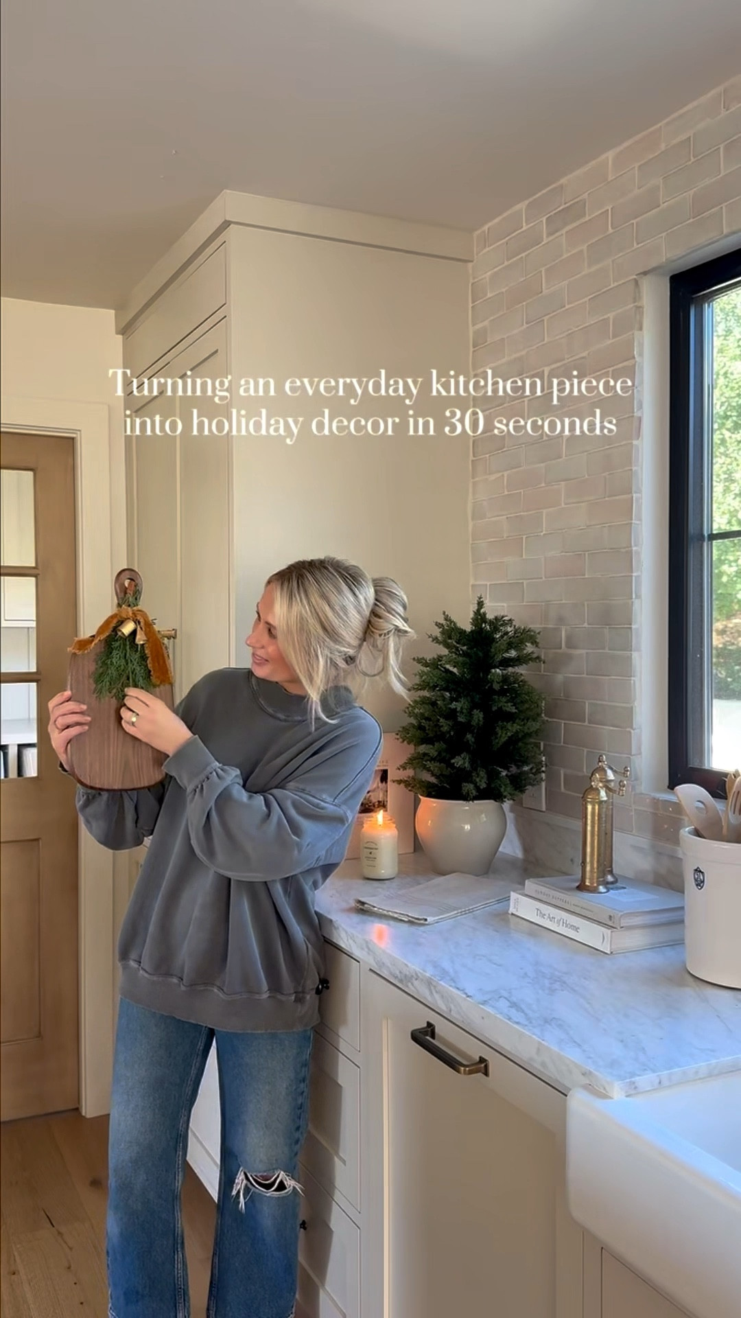Give me 30 seconds and a wood board… and suddenly it’s Christmas in here 🎁 The easiest holiday kitchen decor and hostess gift idea — all linked belowfor quick, cozy shopping! 
SWEATSHIRT: SIZE SMALL

#LTKHoliday #LTKGiftGuide #LTKSeasonal
