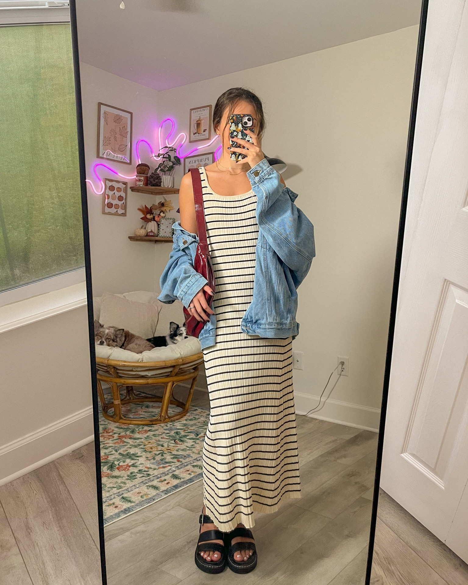 elevated fall outfit idea; maxi dress, denim jacket, red slouchy purse bag