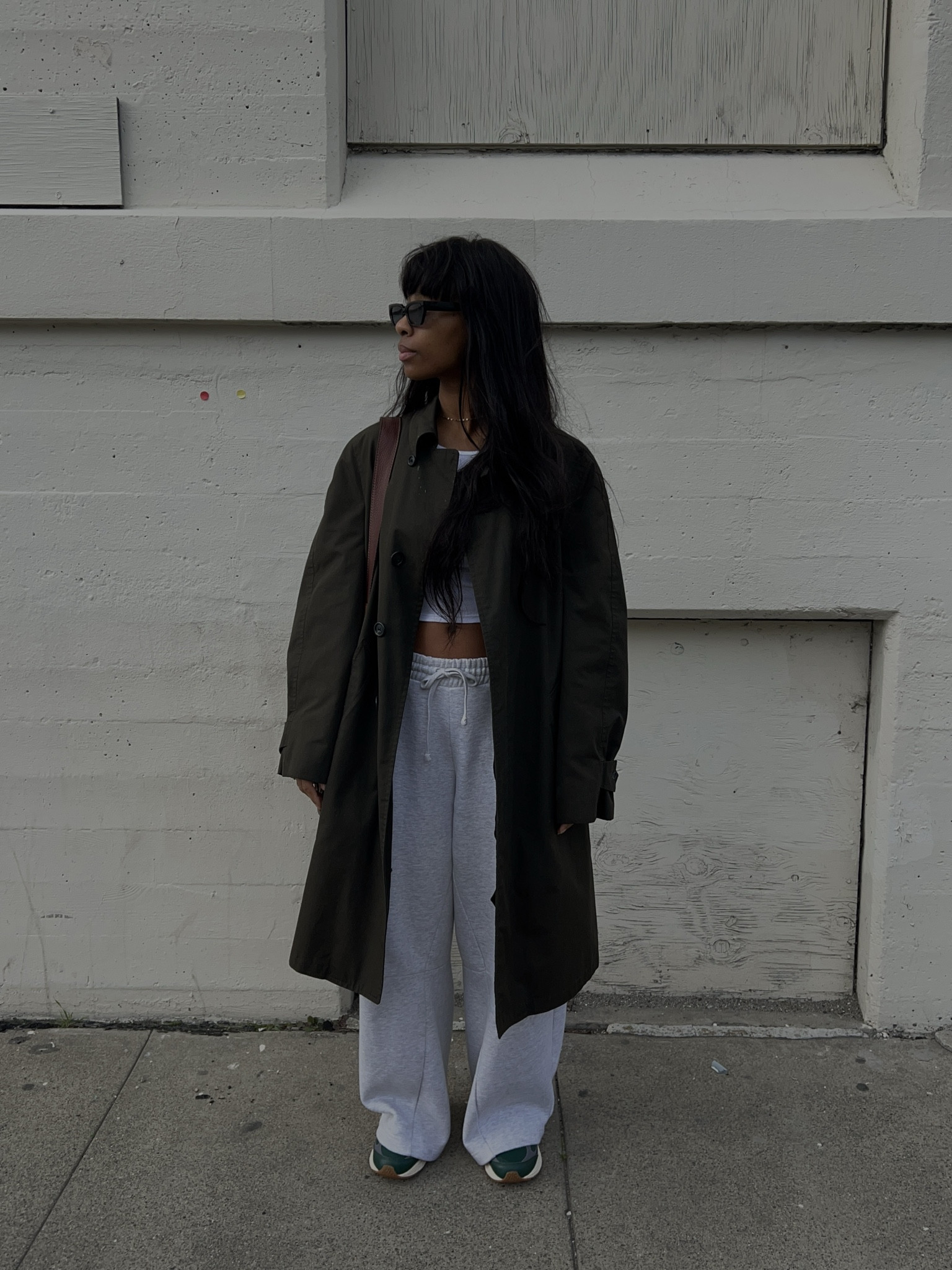 green trench, white tank, grey sweats, green new balances, brown bag. 

#LTKstyletip #LTKshoecrush