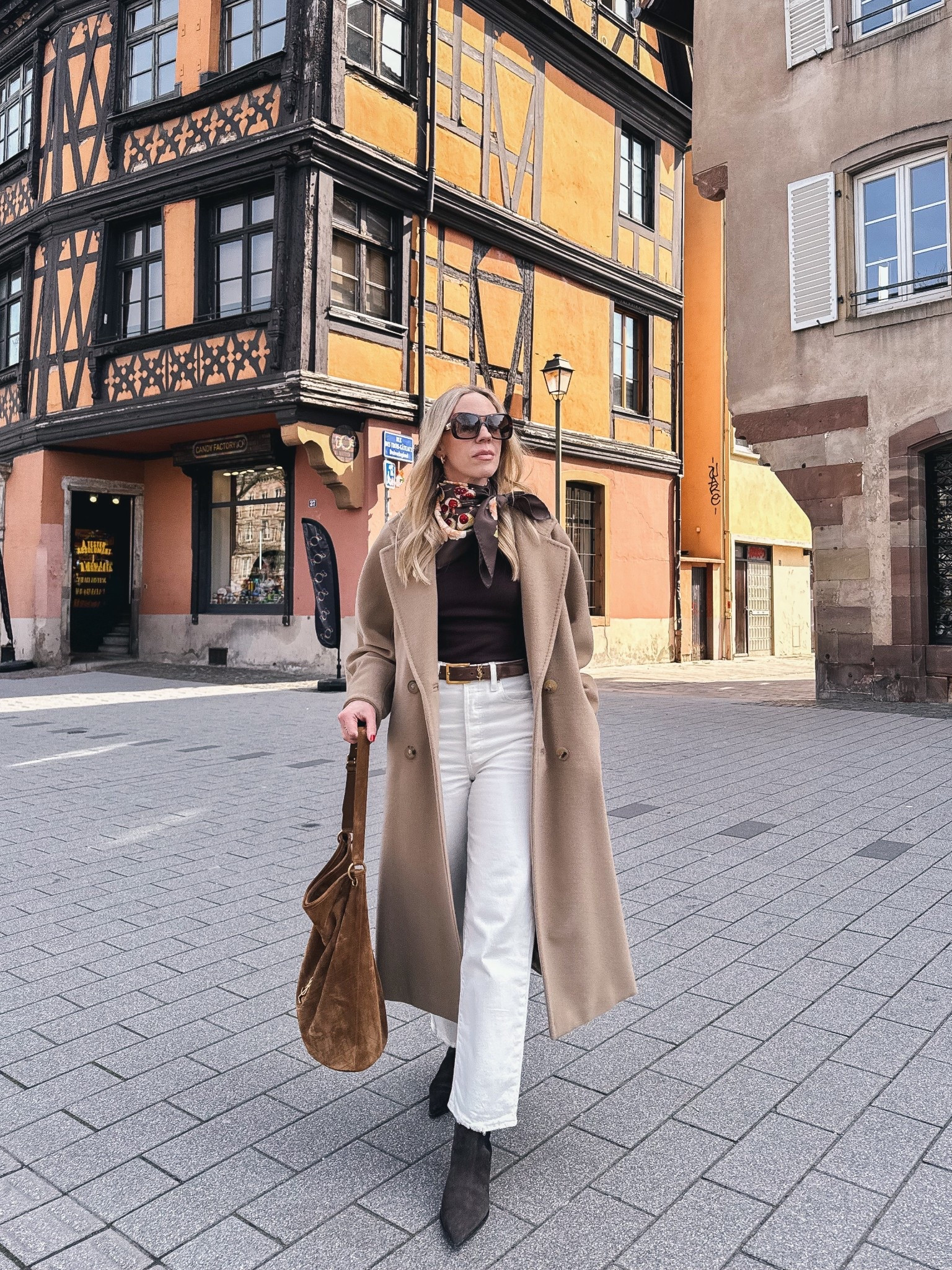 Spring look, silk scarf outfit, camel coat, white jeans with chocolate brown, suede bucket bag, European vacation style 

#LTKOver40 #LTKSeasonal #LTKTravel