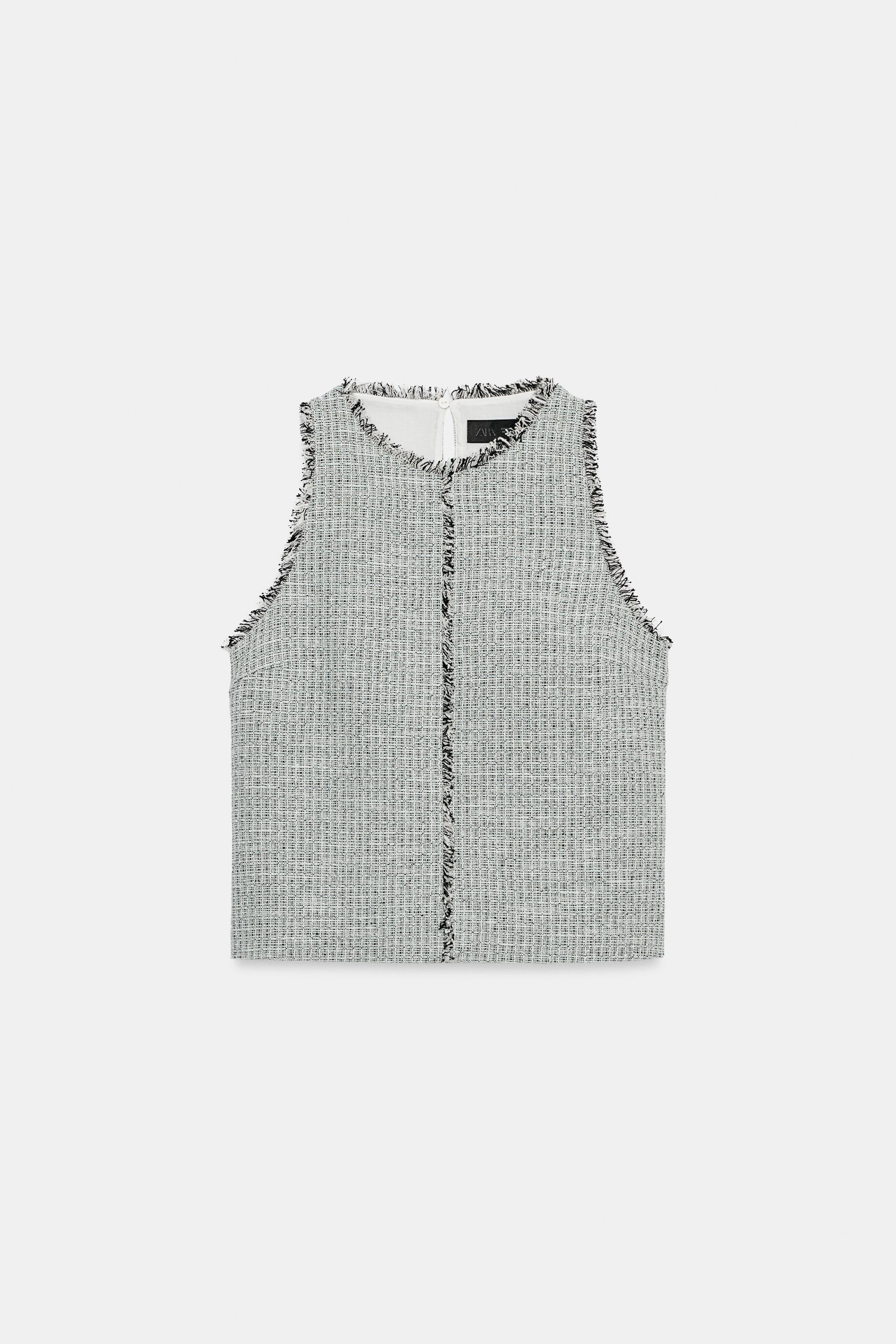 Round neck top with sleeveless cut. Features frayed hem details. Back closure with opening and bu... | Zara US