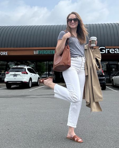 Spring to summer transitional outfit idea! Just bought my favorite Levi’s ribcage in white. I love that these are not a dead white and lean creamier. They are TTS (wearing a 25) and belly button high rise. 

Also wearing..
Cognac Hermes sandal dupes from Target
Madewell classic tote bag
Mango trench 
$15 Nordy sunnies 
Old Target grey v-neck

