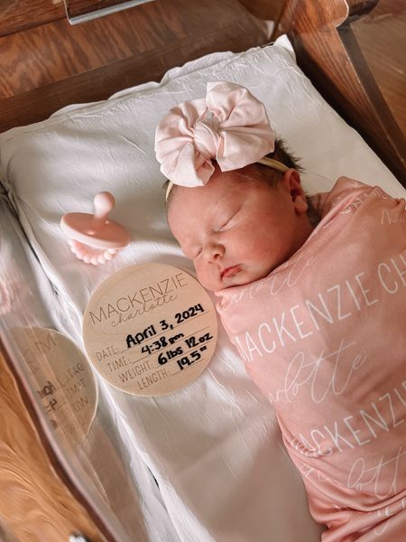 Baby girl receiving blanket and swaddle in soft pink with matching newborn bow headband. Had this exact wood coin with birth statistics for both of my daughters and love how their announcement photos came out!

#LTKfindsunder50 #LTKbaby #LTKbump