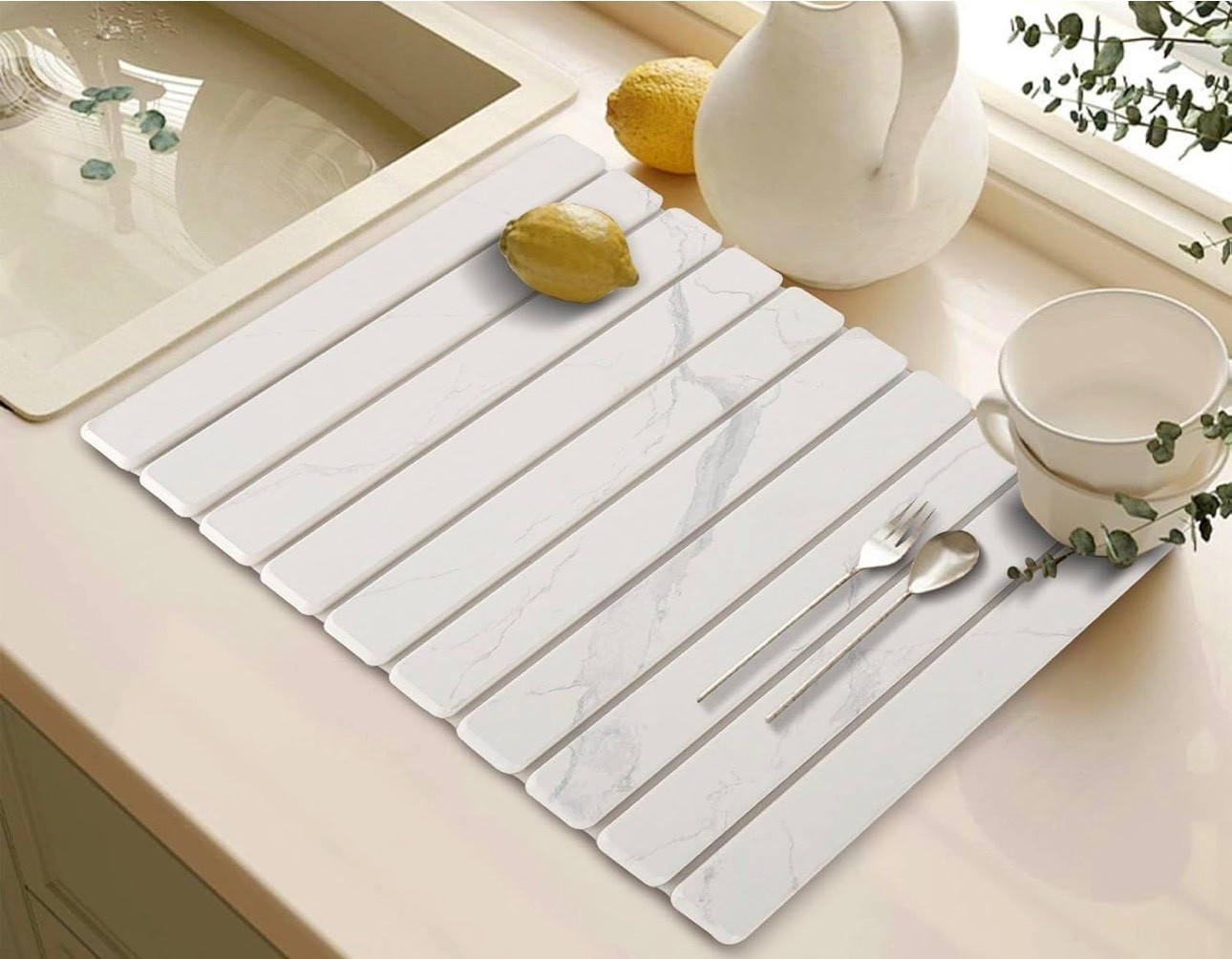 STONE DRYING MAT | Random, but necessary PSA: this stone drying mat has completely changed my kitchen routine. It actually looks pretty on the counter, doesn’t stay wet or get grimy, and it’s perfect for water bottles, hand-wash-only holiday dishes, and all the kid stuff. Truly such a small thing that makes a big difference! Also — this is such a good gift idea for the person who has everything, favorite-things parties, or even Dirty Santa. 

#LTKHome #LTKFindsUnder50 #LTKGiftGuide