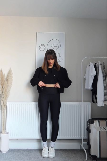 Black bomber jacket, black leggings, black sports bra, white trainers 

#LTKeurope #LTKstyletip #LTKSeasonal