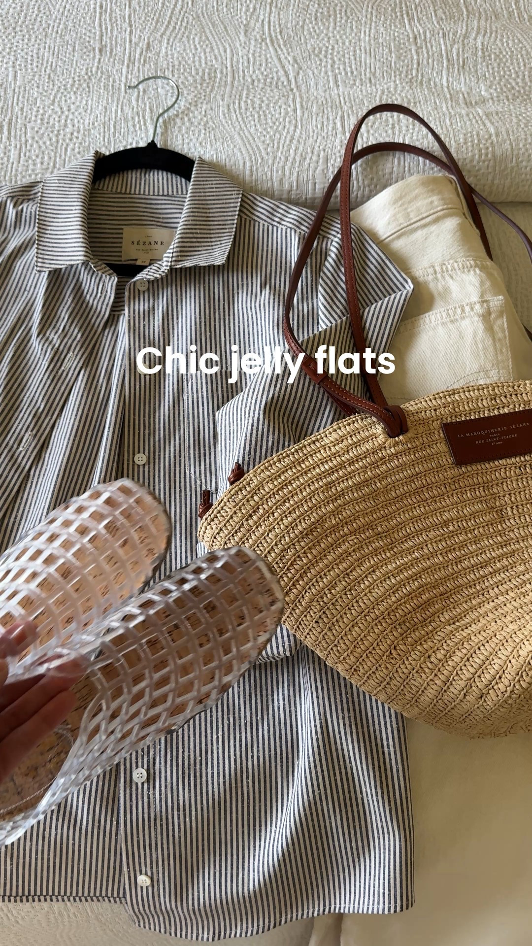 Off- white jeans outfit idea. Modern classic styling with looser fits and jelly flats for a casual vibe. 
- I prefer off- white colors like this ecru for a less formal feel than stark white. 
- Exact jeans are my favorite 100% cotton denim material. Sizing runs big, but I like the relaxed fits for more casual outfits. 
- Striped button down Spring staple piece to dress up or down. Exact top runs small. 
- Jelly flats are nostalgic, but feel fresh in this designer inspired style. True to size or size up if in doubt. I aired them out in the garage a couple of days to get rid of the plastic smell  
- Straw tote bag is a classic warmer weather choice. 


#LTKOver40 #LTKShoeCrush #LTKFindsUnder50