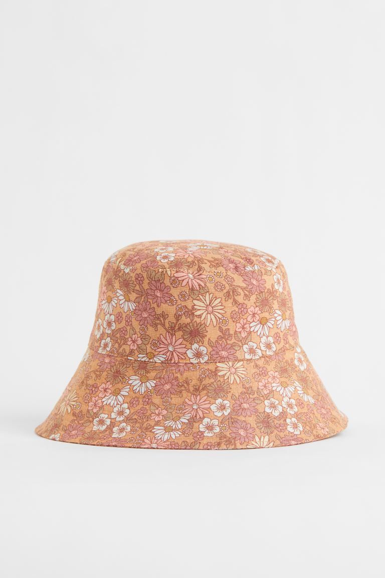 Kids Exclusive. Bucket hat in linen with a printed floral design. Sloped brim. Lining in woven co... | H&M (US + CA)