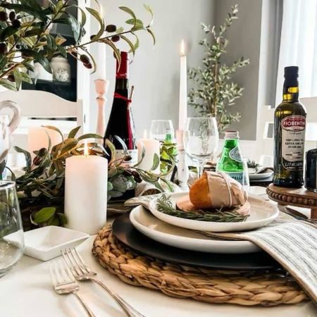 Set the table for a stylish dinner party with black and white decor, woven charger plates, artificial olive branches, ticking stripe napkins, and candles. 

#LTKhome #LTKparties #LTKfindsunder50