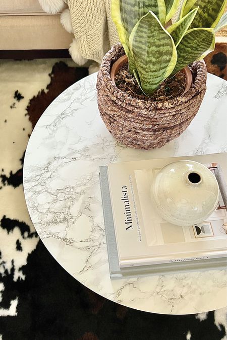 Make a faux marble coffee table with self-adhesive vinyl film and a wood round  

#LTKFind #LTKhome