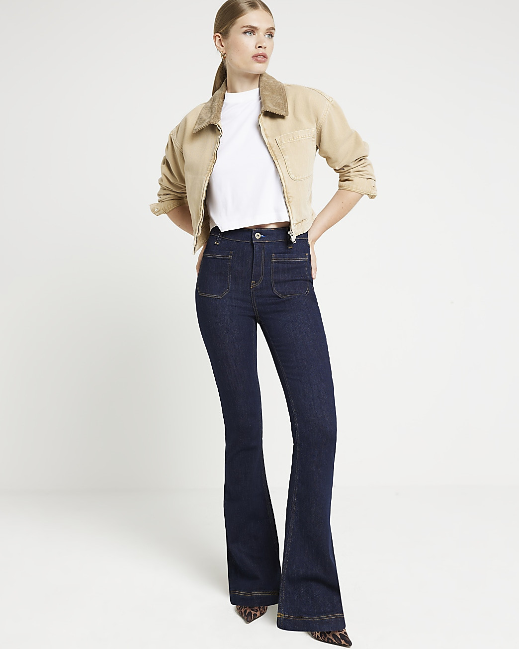 Blue front pocket flared jeans | River Island (UK & IE)