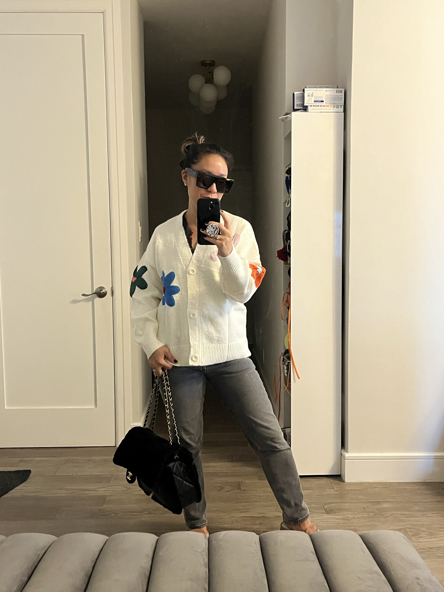 Sweater weather. Cream color way. Almost white. Love a button down cardigan. Love the pop of color in the flowers. Very soft. Oversized. I’m wearing a small. Jeans are a 26. Accessories are the splurge. What are you wearing on the colder days?

#LTKGiftGuide #LTKCyberWeek #LTKFindsUnder50