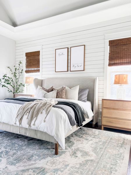 Master primary bedroom modern farmhouse style coastal European classic transitional bedding sham quilt blanket throw pillows covers large oversized nightstands dressers bamboo woven blinds shades in Malay umber mercury glass lamps wall signs 

#LTKFind #LTKhome #LTKSeasonal