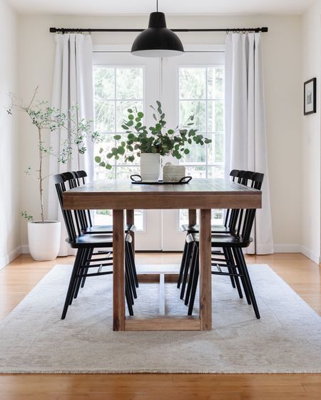 Simple dining room with farmhouse style table, black Windsor style dining chairs, and neutral dining room rug.

Pottery barn rug, Serena & Lily dining chairs, farmhouse table 

#LTKstyletip #LTKFind #LTKhome