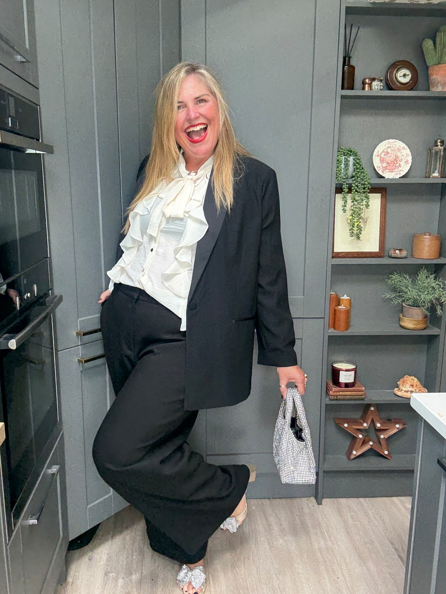 Tuxedo jacket, tuxedo trousers, ruffle shirt, sparkly bag, sparkly heels 

#LTKplussize #LTKfestive #LTKpartywear