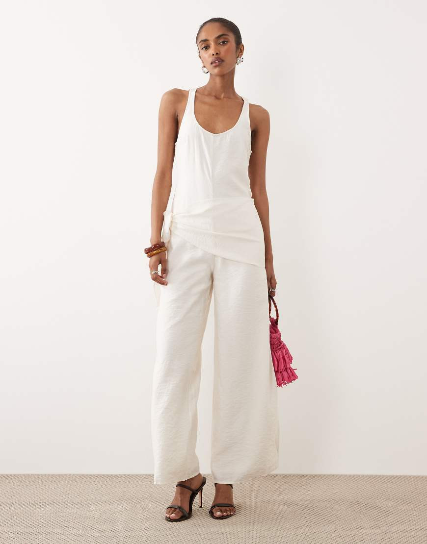 ASOS DESIGN satin crinkle jumpsuit with scarf waist detail in cream-White | ASOS (Global)