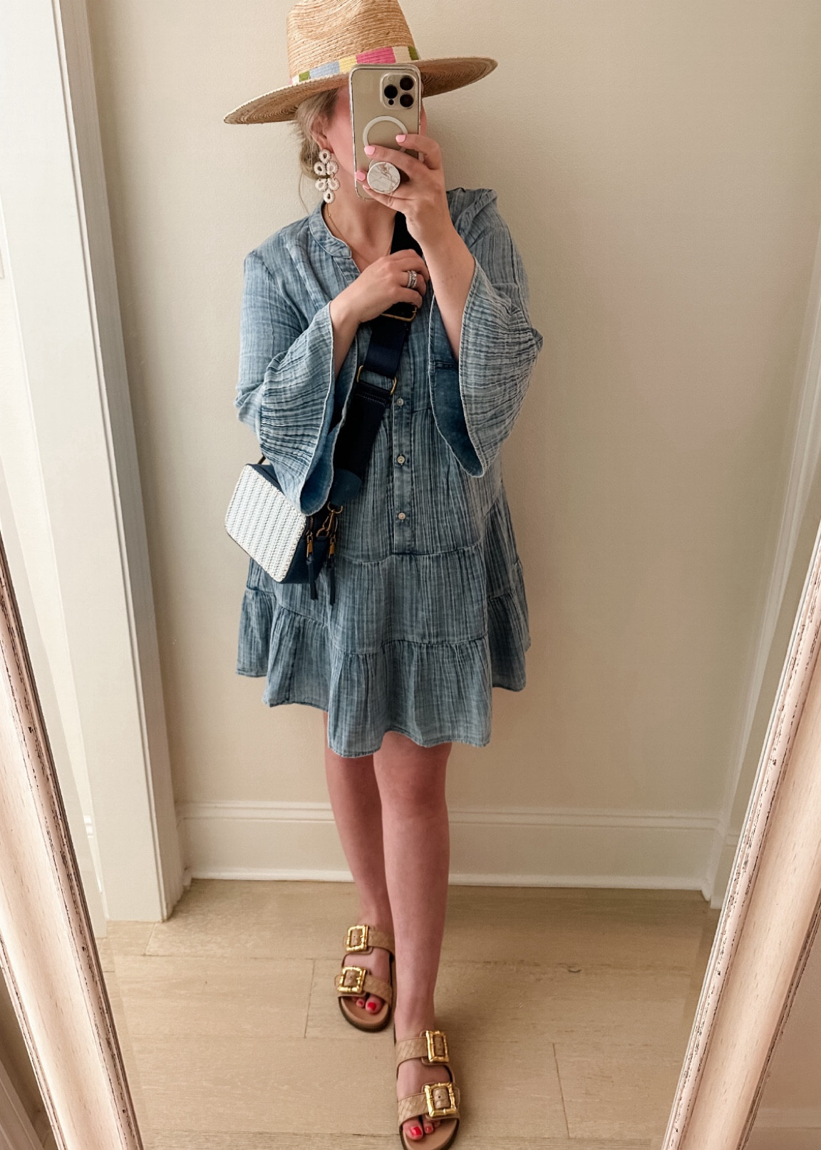 Slides run true to size for me. Dress has a slightly oversized fit - I would recommend sizing down in the dress if between sizes. Easy throw on and go dress that’s so soft and comfy! I bought the hat last year and still love it! 